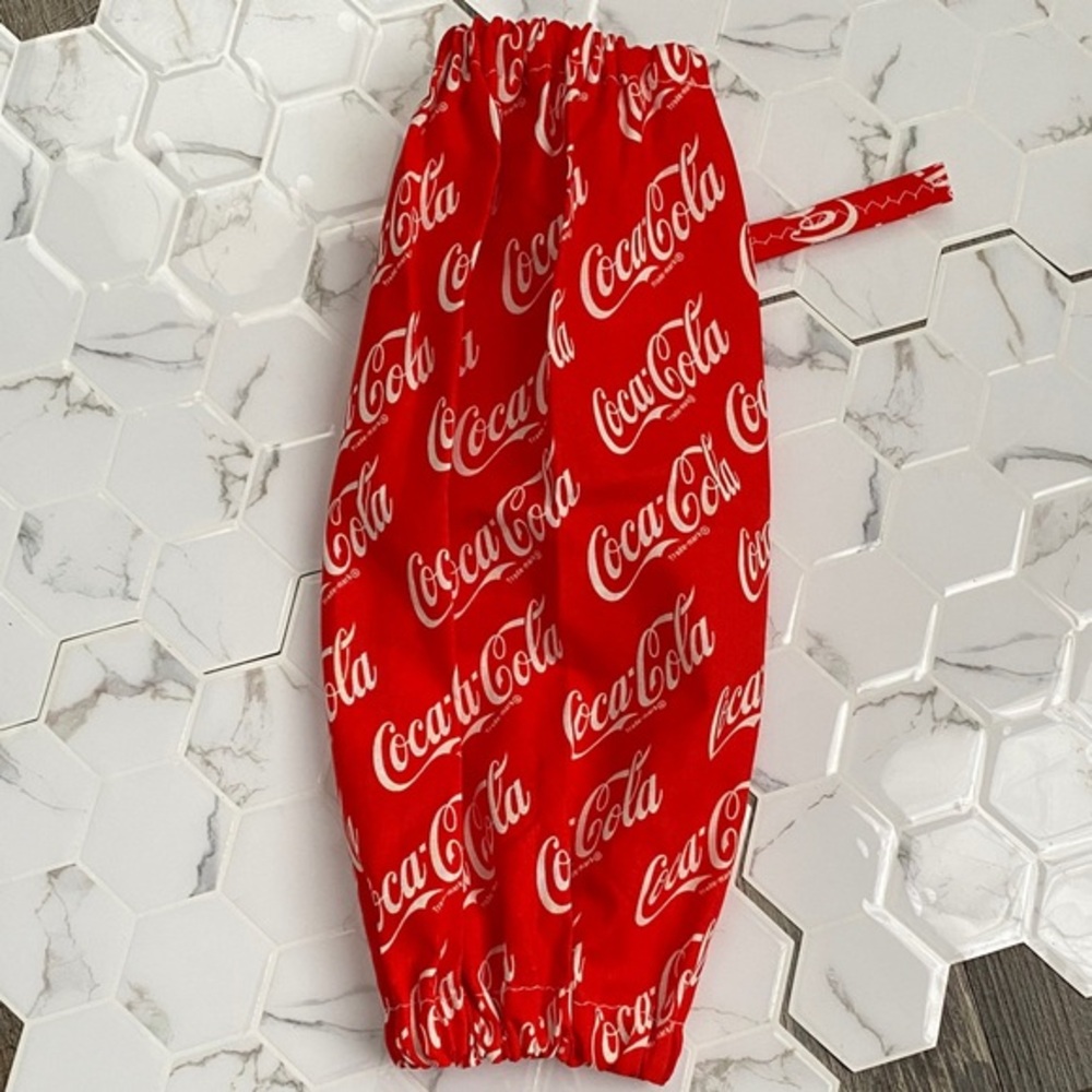 Handmade wall hanging grocery bags organizer and pantry with Coca Cola logo.